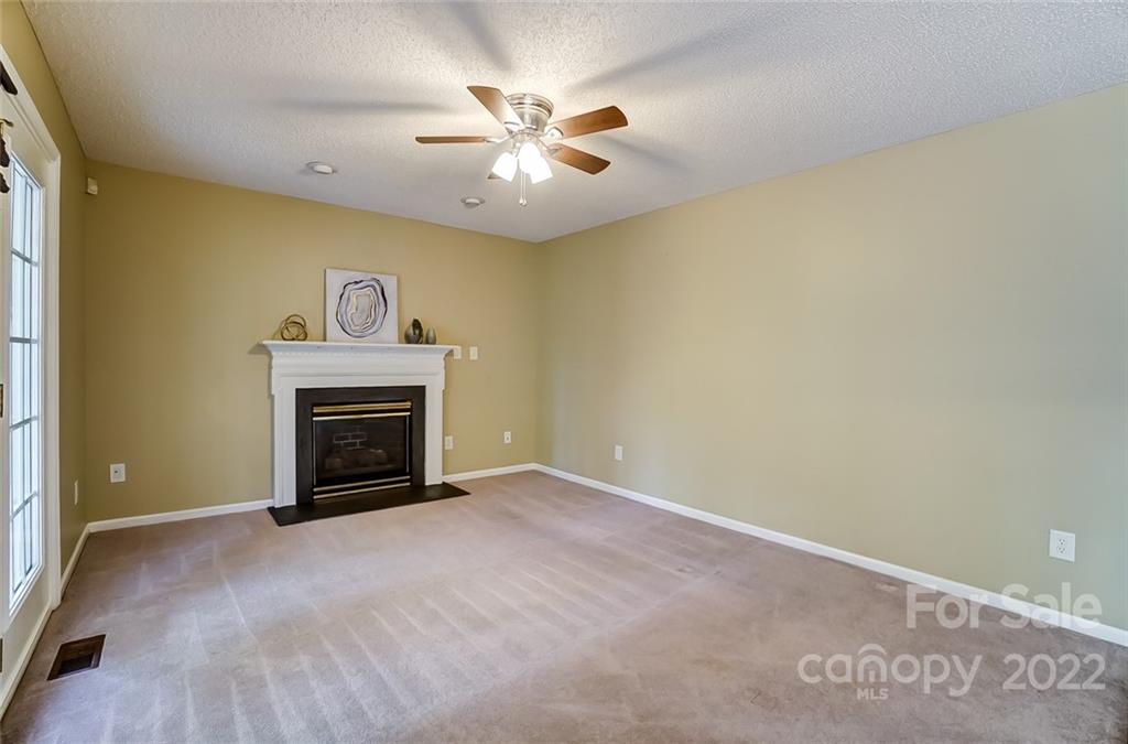 104 High Ridge Court West Mount Holly, NC 28120 - Photo 11 of 34 a view of an empty room with a fireplace