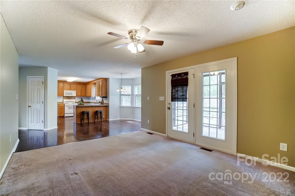 104 High Ridge Court West Mount Holly, NC 28120 - Photo 12 of 34 a view of a livingroom with furniture window and wooden floor