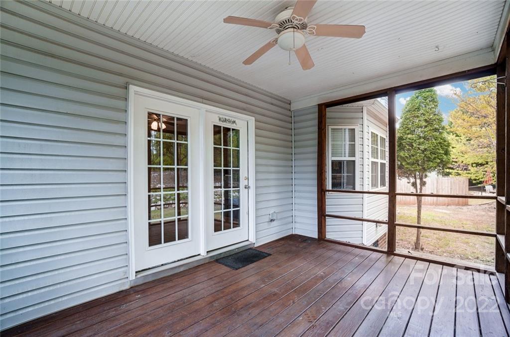 104 High Ridge Court West Mount Holly, NC 28120 - Photo 15 of 34 a view of a livingroom with wooden floor and a ceiling fan