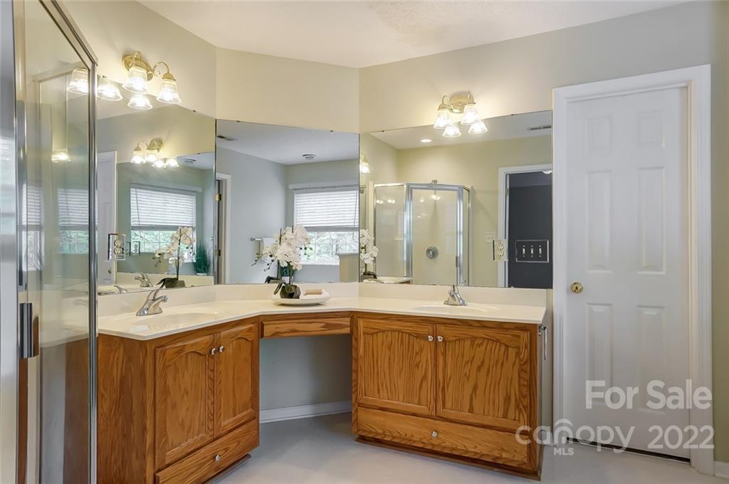 104 High Ridge Court West Mount Holly, NC 28120 - Photo 24 of 34 a view of a kitchen with a sink and chandelier