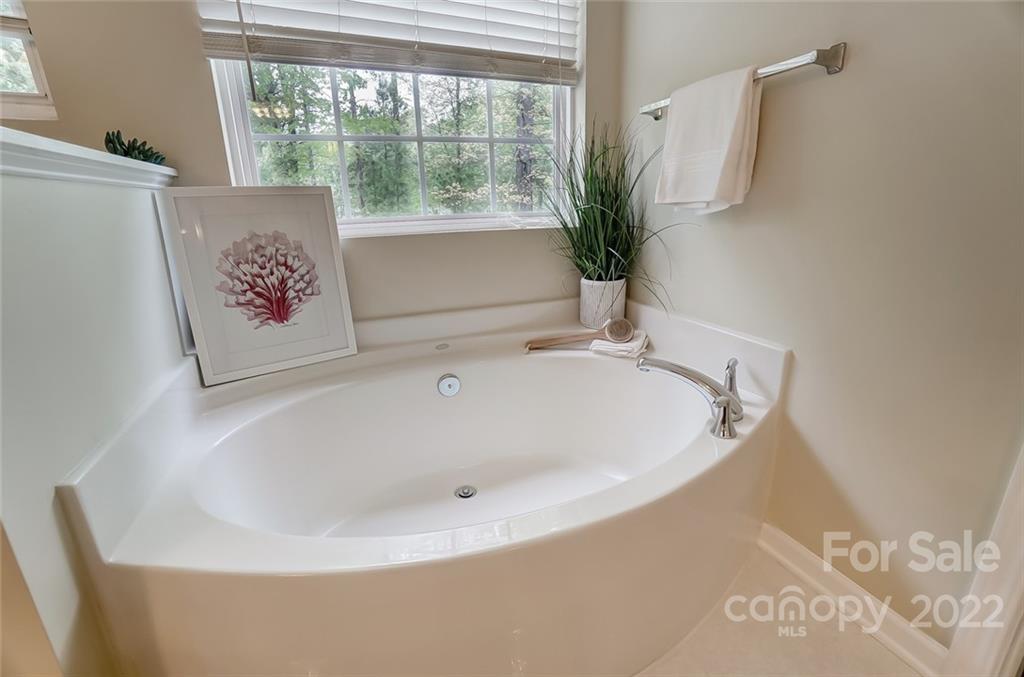 104 High Ridge Court West Mount Holly, NC 28120 - Photo 26 of 34 a white bath tub sitting in a bathroom next to a window