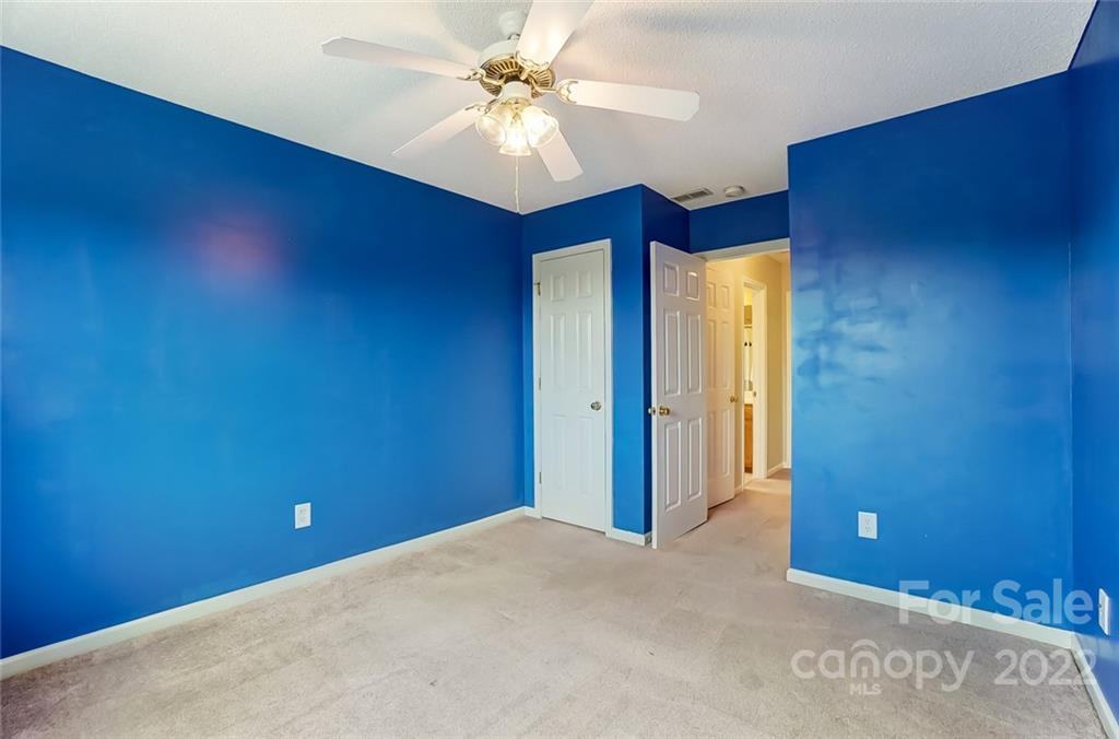104 High Ridge Court West Mount Holly, NC 28120 - Photo 30 of 34 an empty room with windows and fan