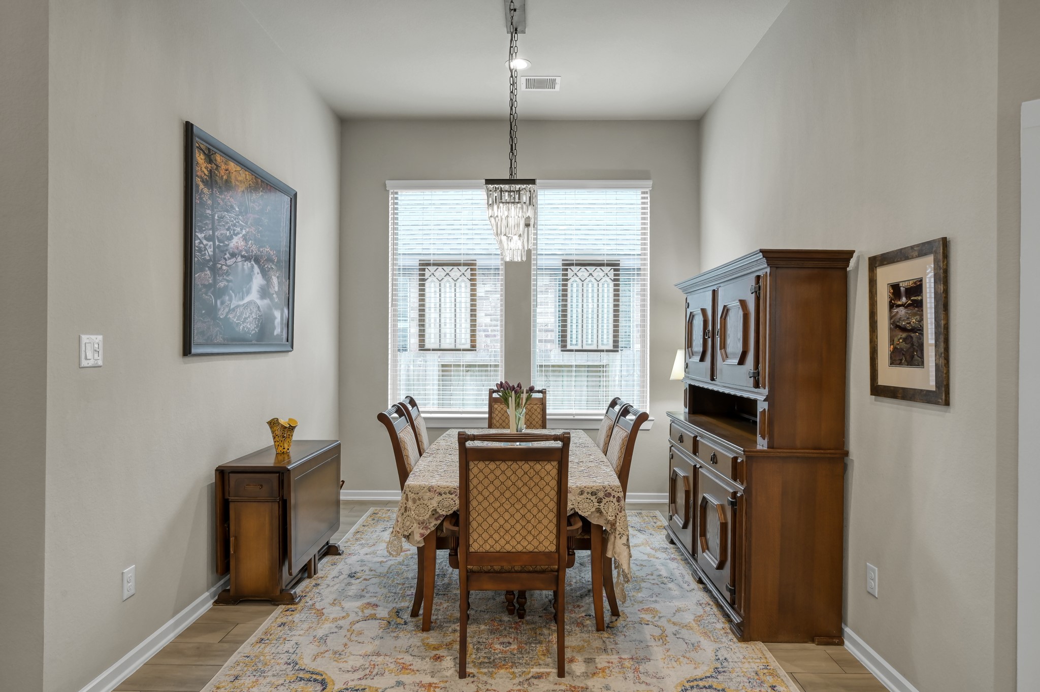 111 Yellow Perch Way Conroe, TX 77318 - Photo 5 of 35 Formal dining room featuring upgraded chandelier and dimmer lighting.