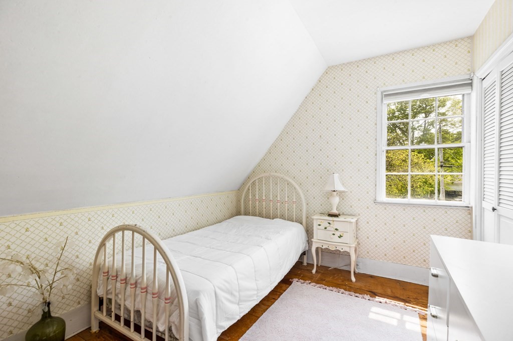 59 Cottage Street Hingham, MA 02043 - Photo 16 of 28 a bedroom with a bed and a window