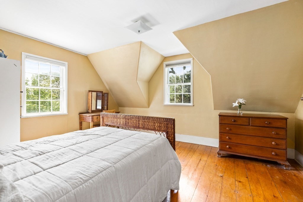 59 Cottage Street Hingham, MA 02043 - Photo 17 of 28 a bedroom with a bed and a window