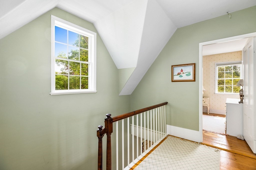 59 Cottage Street Hingham, MA 02043 - Photo 20 of 28 a view of a hallway with windows
