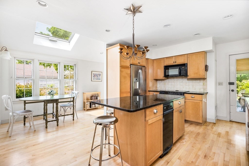 59 Cottage Street Hingham, MA 02043 - Photo 2 of 28 a open kitchen with stainless steel appliances granite countertop a stove and a wooden floors