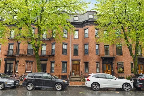 a car parked in front of a building