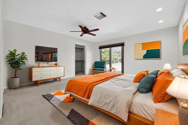 a large kitchen with stainless steel appliances granite countertop a stove refrigerator and a sink