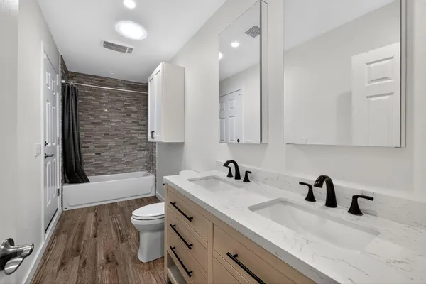a bathroom with a sink and mirror
