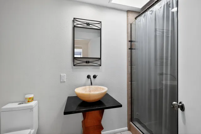 a kitchen with stainless steel appliances white cabinets and a stove