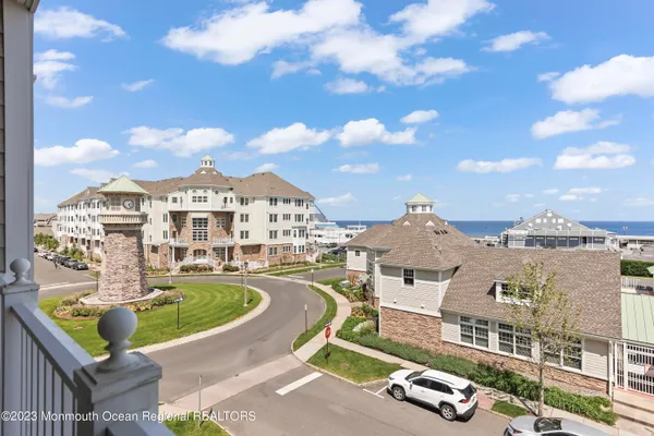 aerial view of a house with swimming pool and furniture