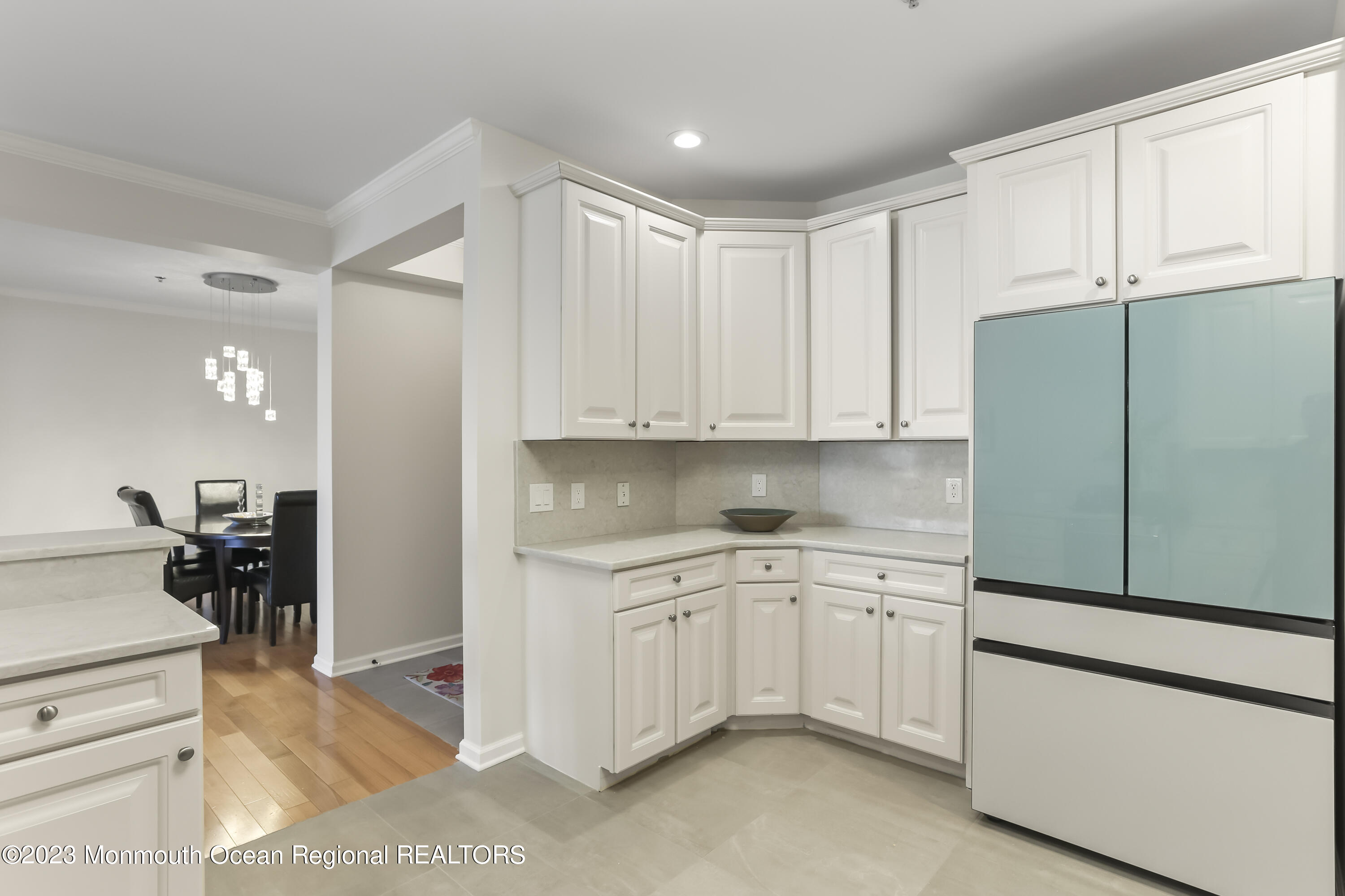 22 Cooper Avenue, Unit 309 Long Branch, NJ 07740 - Photo 12 of 52 a kitchen with white cabinets and white appliances