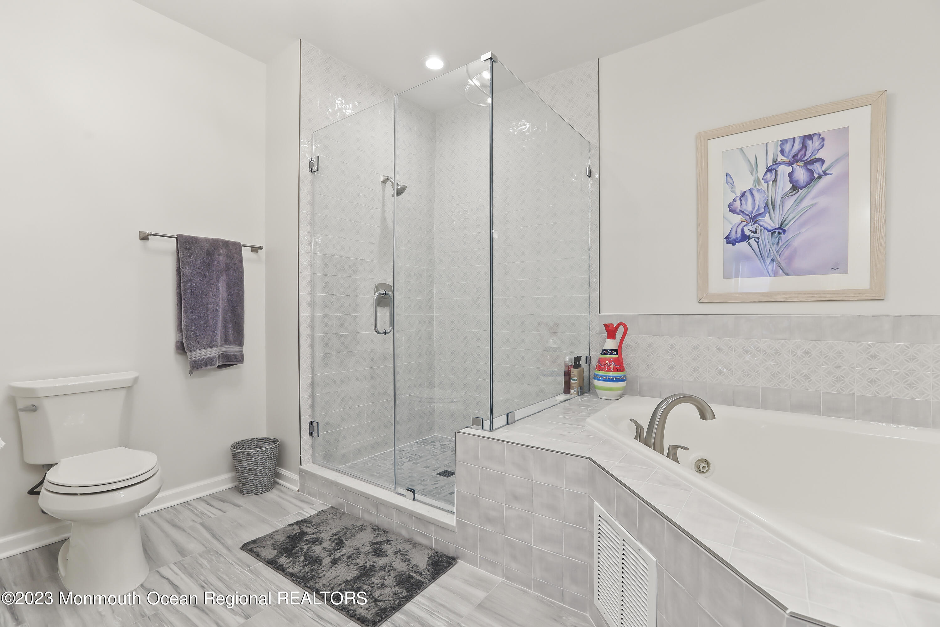 22 Cooper Avenue, Unit 309 Long Branch, NJ 07740 - Photo 18 of 52 a bathroom with a granite countertop sink a toilet and shower