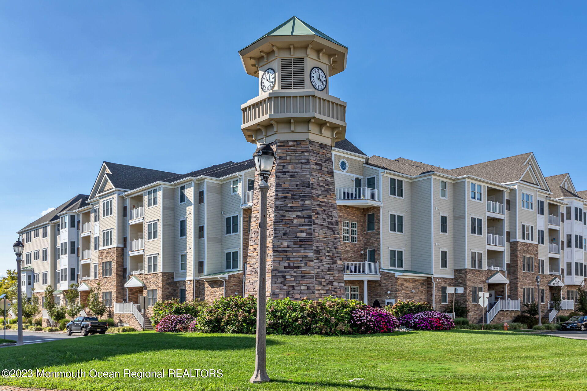 22 Cooper Avenue, Unit 309 Long Branch, NJ 07740 - Photo 24 of 52 a front view of a building with garden