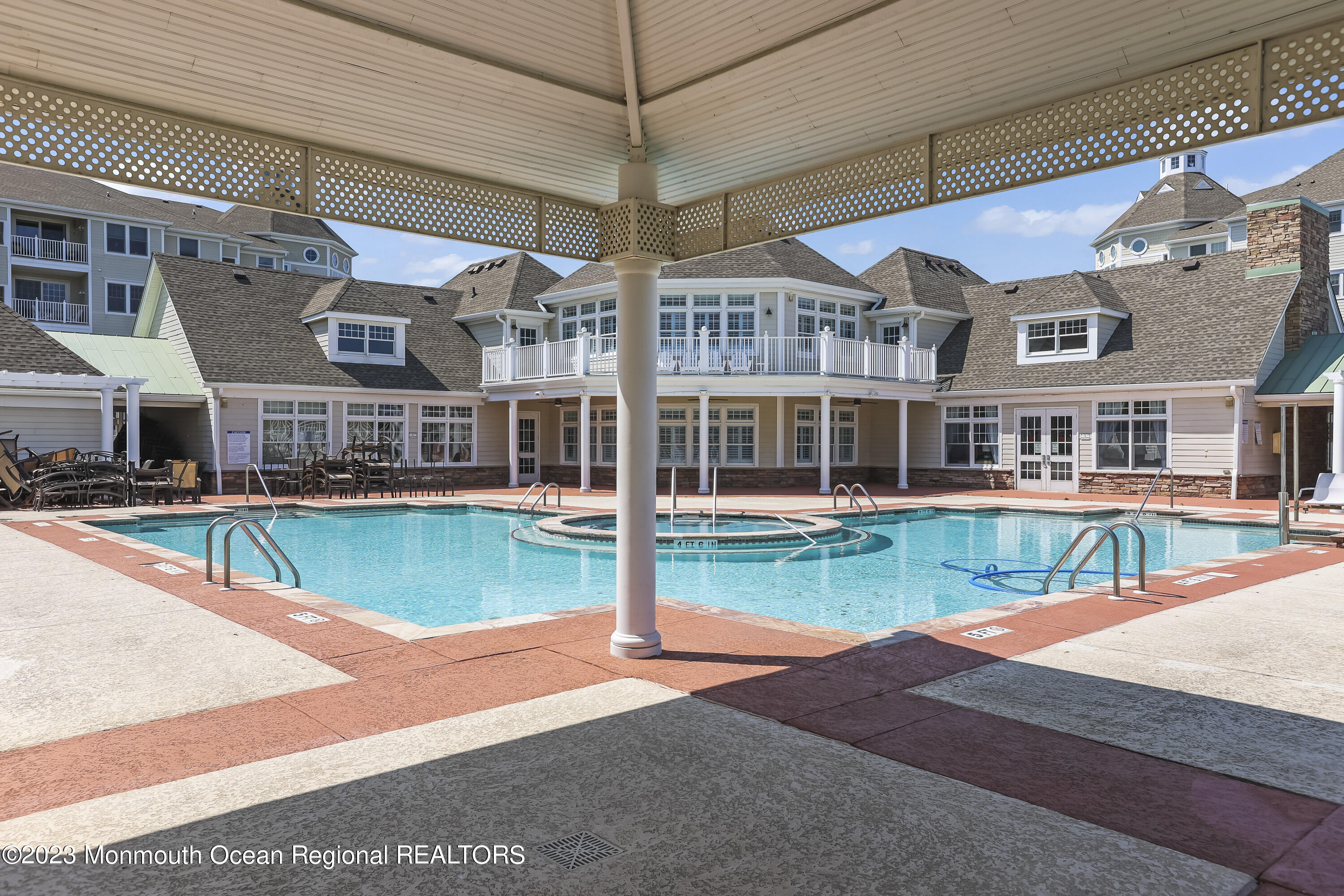 22 Cooper Avenue, Unit 309 Long Branch, NJ 07740 - Photo 27 of 52 a view of a building with a swimming pool