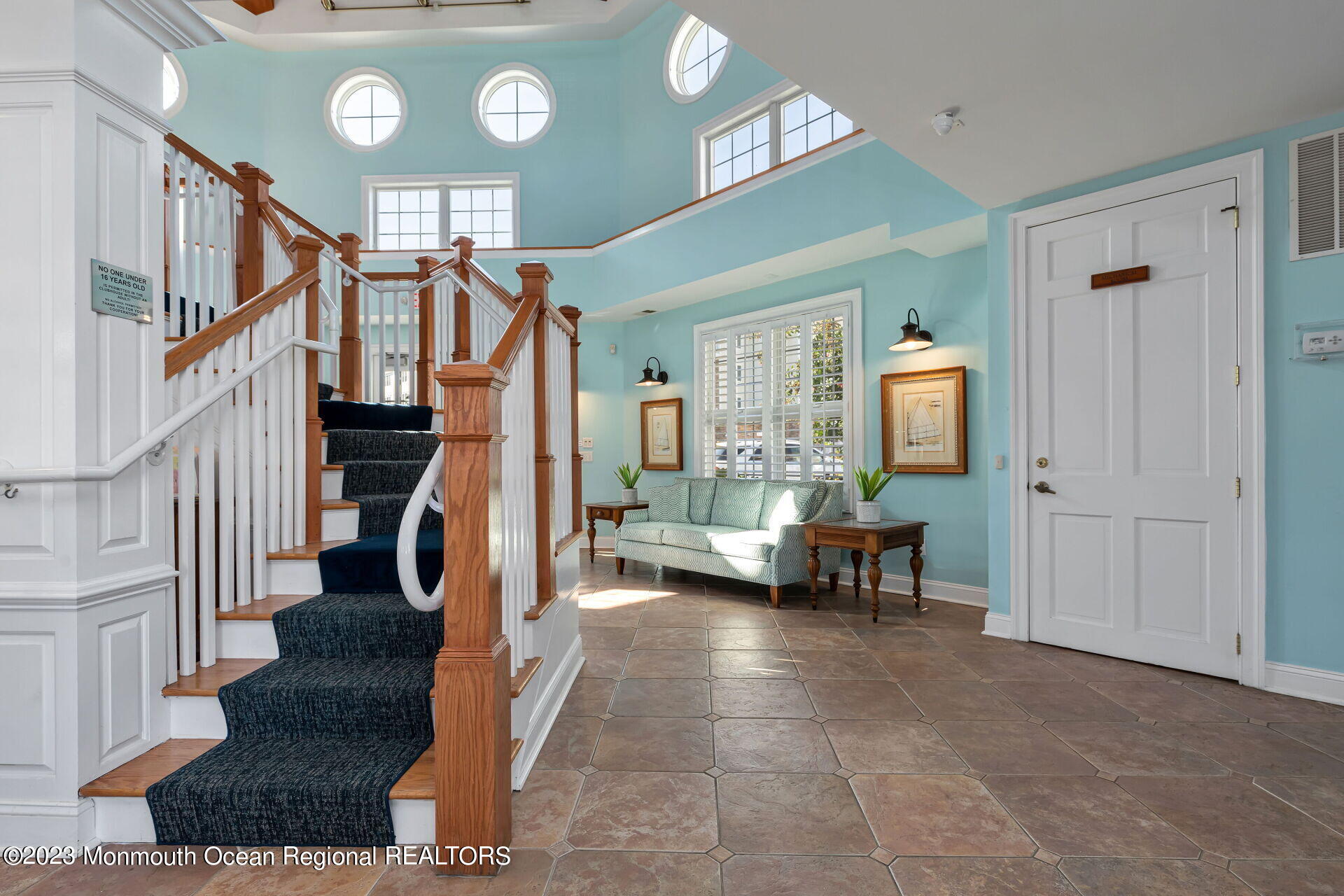 22 Cooper Avenue, Unit 309 Long Branch, NJ 07740 - Photo 28 of 52 a living room with furniture and a clock