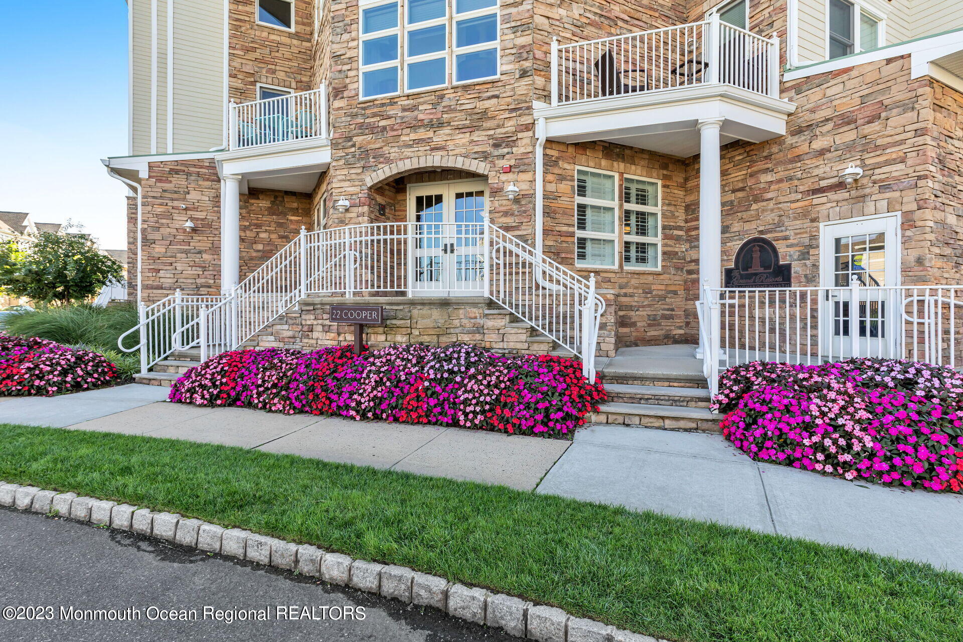 22 Cooper Avenue, Unit 309 Long Branch, NJ 07740 - Photo 39 of 52 front view of a house with a yard