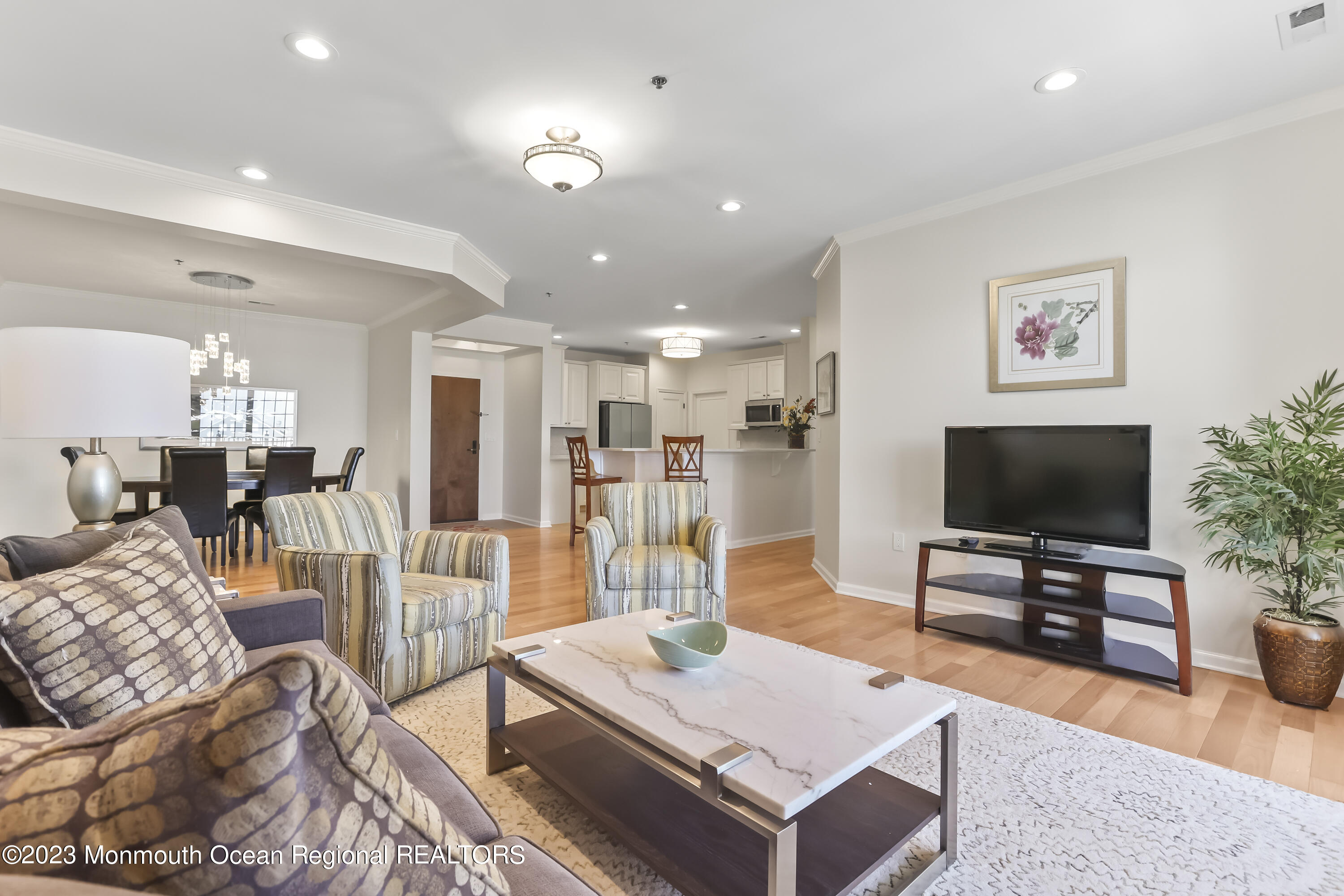 22 Cooper Avenue, Unit 309 Long Branch, NJ 07740 - Photo 4 of 52 a living room with furniture and a flat screen tv