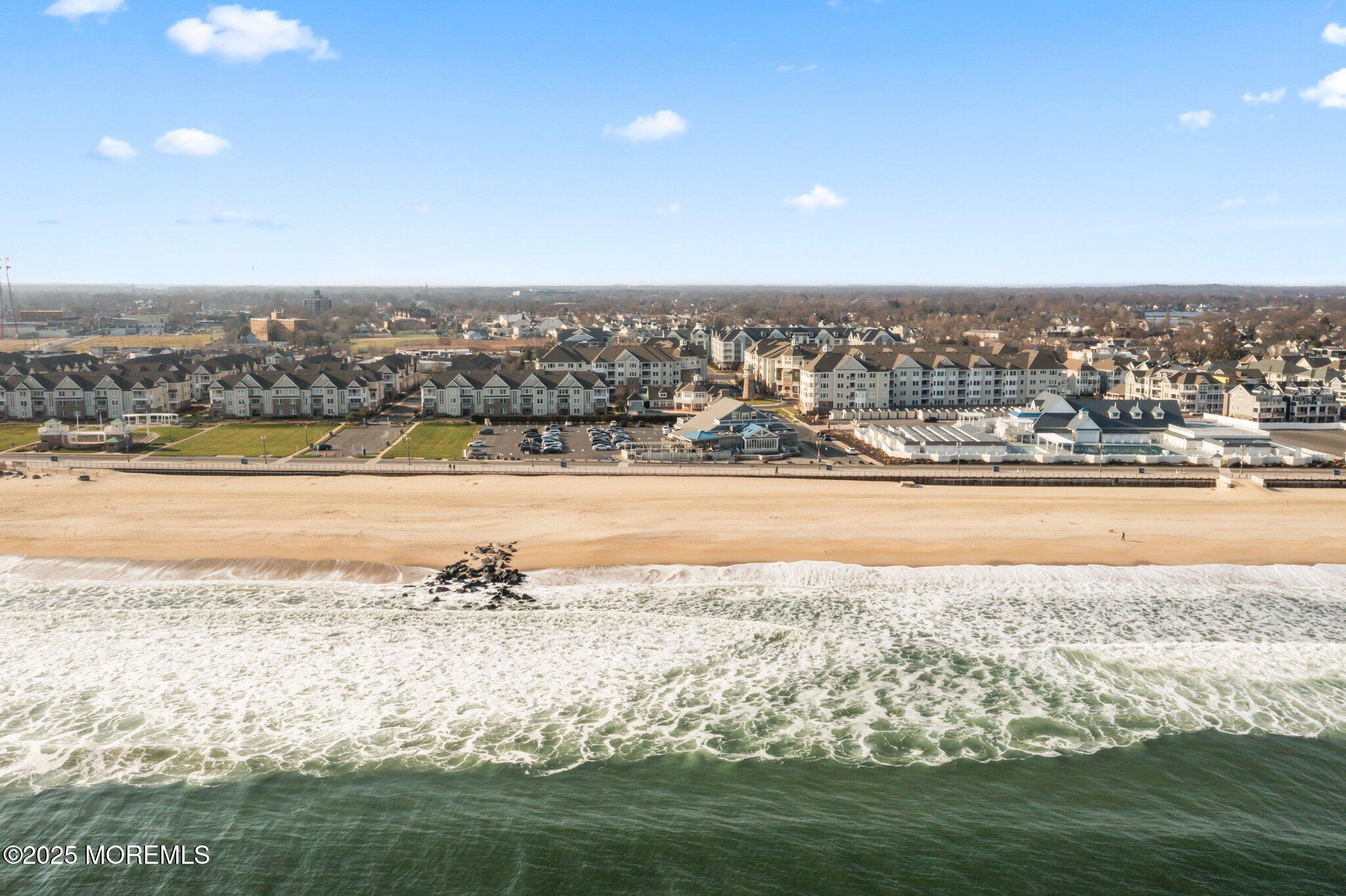 22 Cooper Avenue, Unit 309 Long Branch, NJ 07740 - Photo 46 of 52 a view of an ocean and a beach