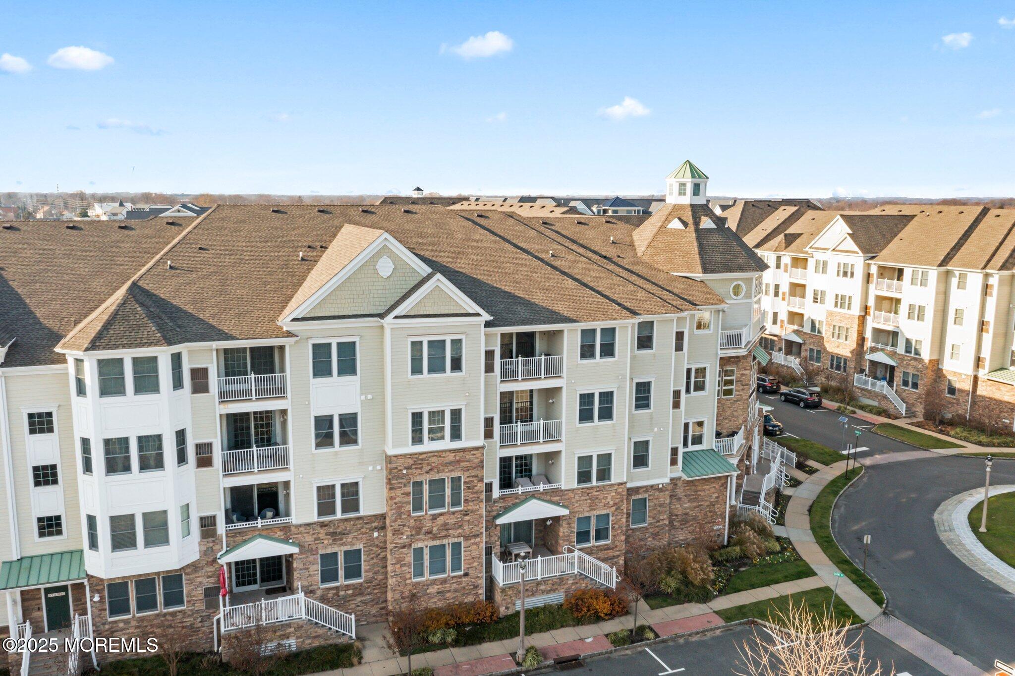 22 Cooper Avenue, Unit 309 Long Branch, NJ 07740 - Photo 48 of 52 a view of a large building with a outdoor space