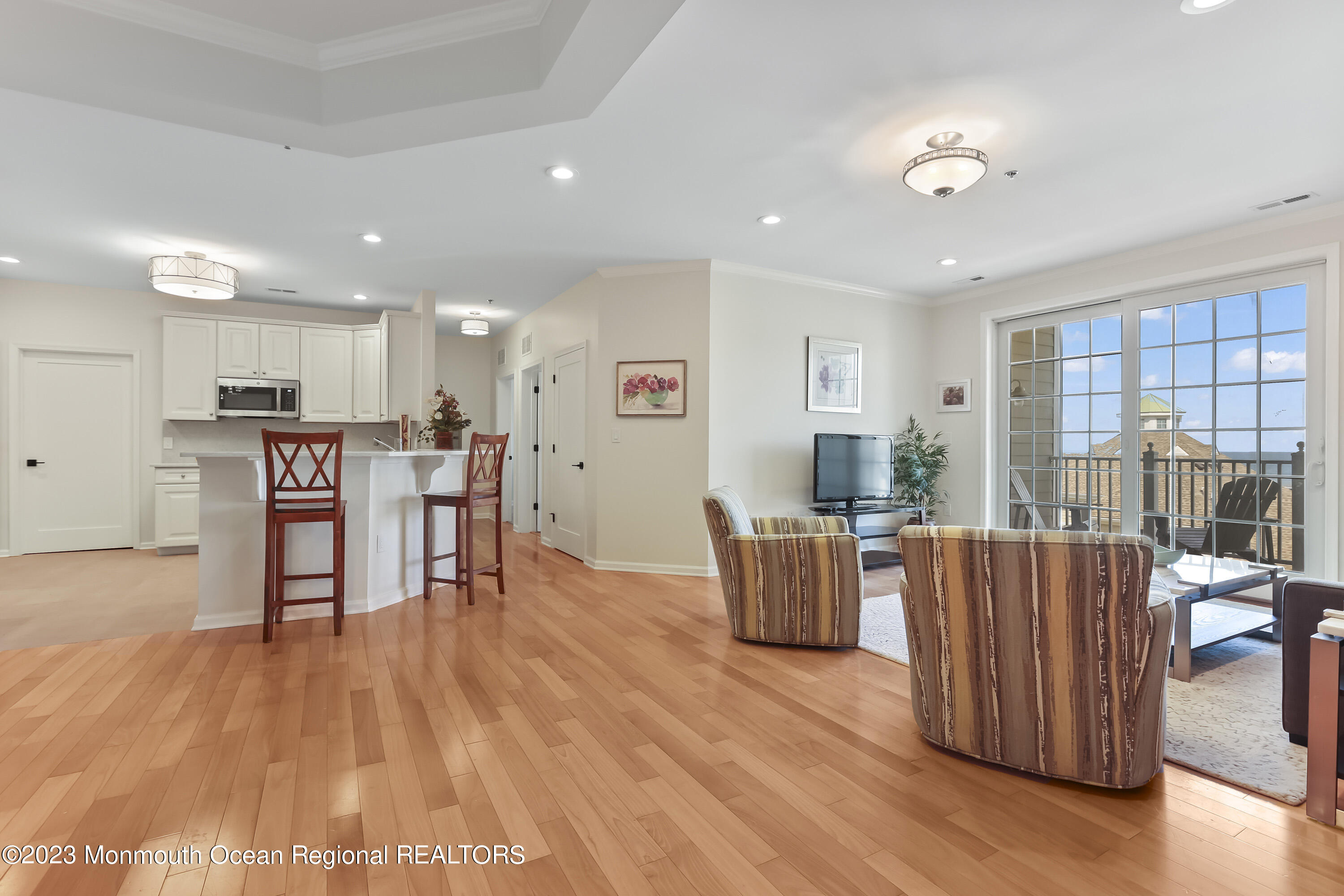 22 Cooper Avenue, Unit 309 Long Branch, NJ 07740 - Photo 6 of 52 a living room with furniture and a wooden floor