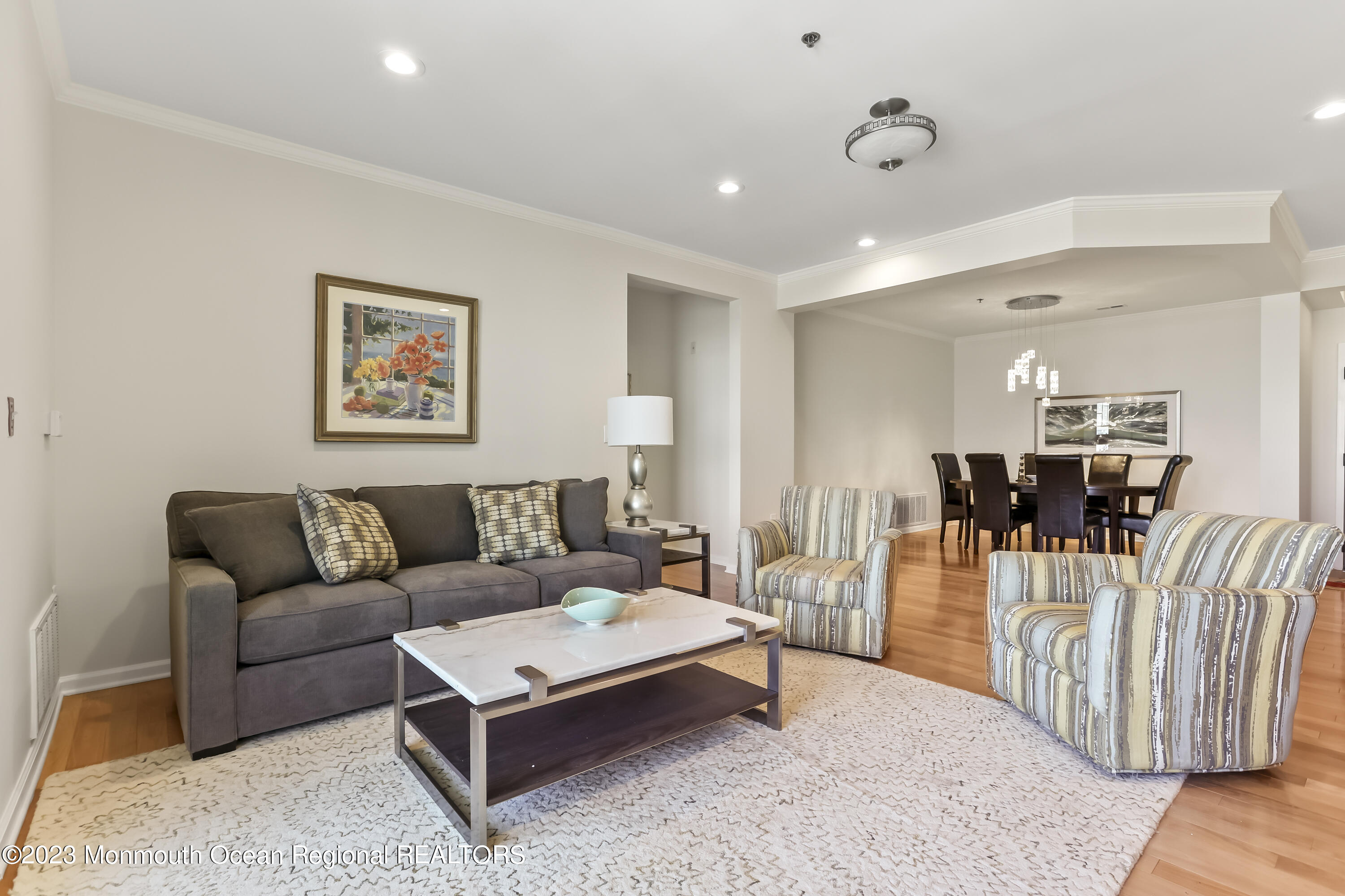 22 Cooper Avenue, Unit 309 Long Branch, NJ 07740 - Photo 9 of 52 a living room with furniture a couch and a table