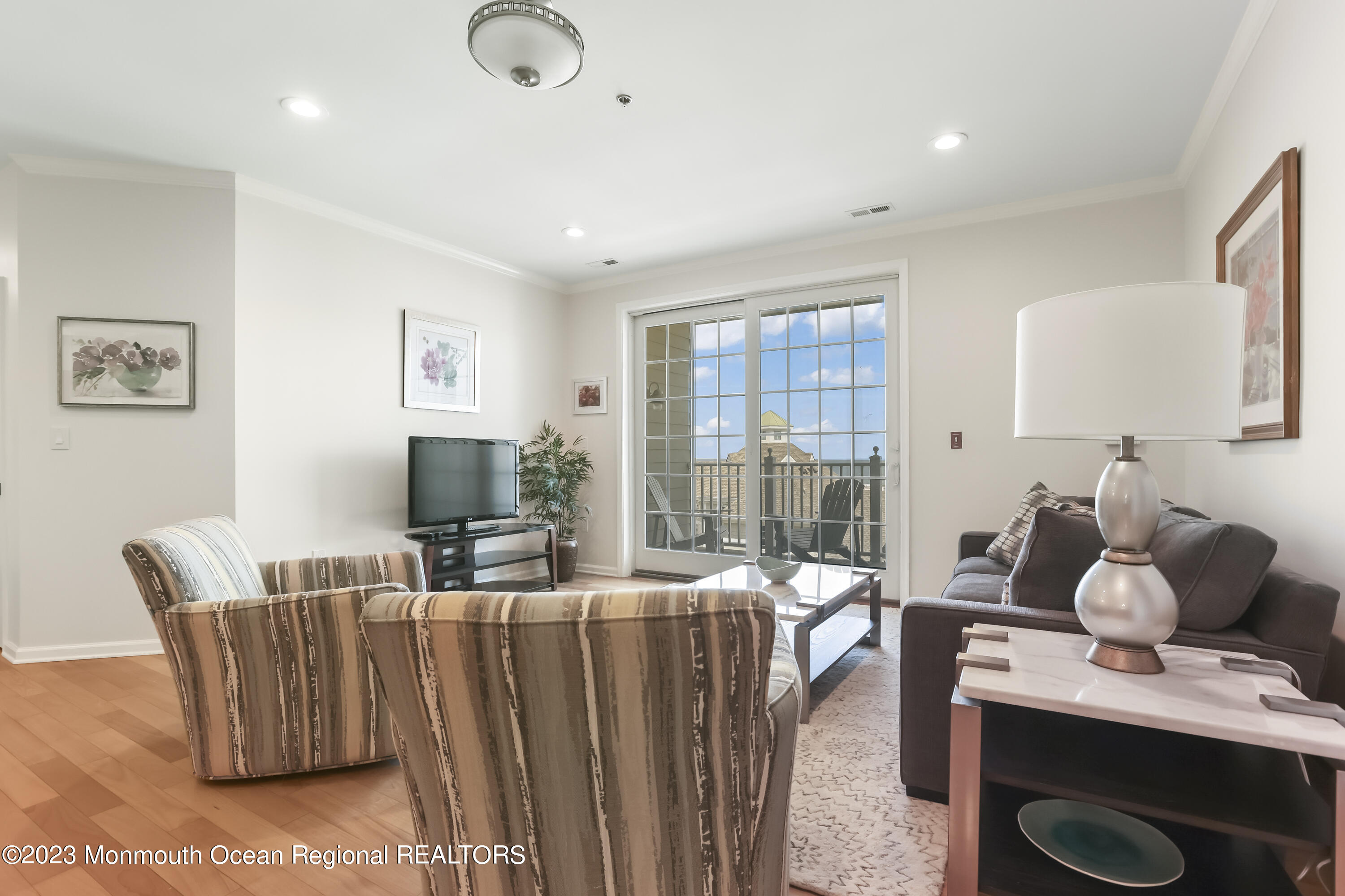 22 Cooper Avenue, Unit 309 Long Branch, NJ 07740 - Photo 10 of 52 a living room with furniture