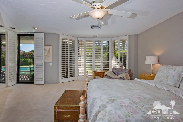 6 Exeter Court Rancho Mirage, CA 92270 - Photo 11 of 20 a bedroom with furniture and large windows