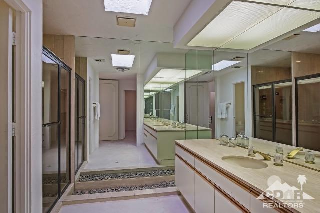 6 Exeter Court Rancho Mirage, CA 92270 - Photo 13 of 20 a bathroom with double vanity sinks and a mirror