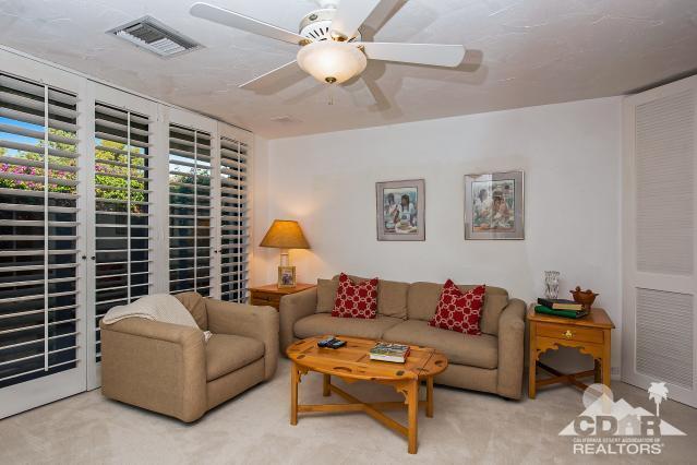 6 Exeter Court Rancho Mirage, CA 92270 - Photo 14 of 20 a living room with furniture and a large window