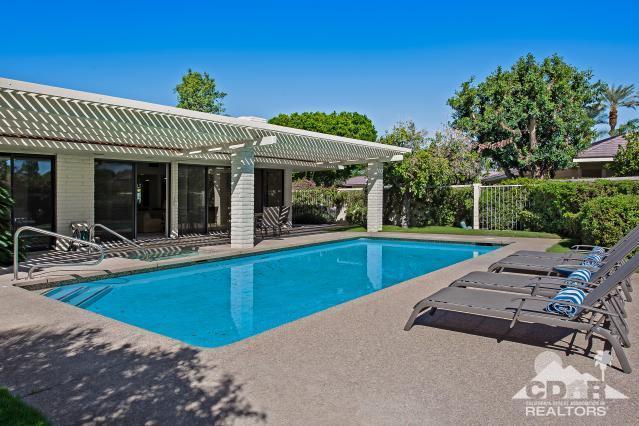 6 Exeter Court Rancho Mirage, CA 92270 - Photo 16 of 20 a view of a house with a swimming pool