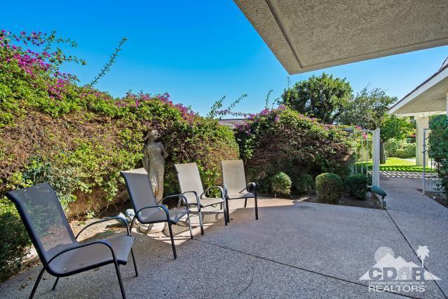 6 Exeter Court Rancho Mirage, CA 92270 - Photo 18 of 20 a view of a chairs and table in the backyard