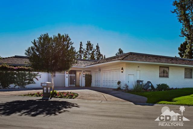 6 Exeter Court Rancho Mirage, CA 92270 - Photo 2 of 20 a front view of a house with a garden