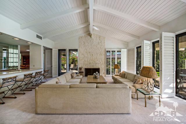 6 Exeter Court Rancho Mirage, CA 92270 - Photo 4 of 20 a living room with fireplace furniture and a large window
