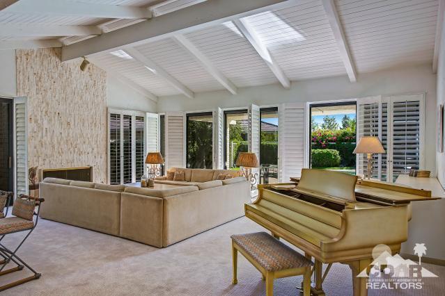 6 Exeter Court Rancho Mirage, CA 92270 - Photo 5 of 20 a living room with furniture and floor to ceiling windows