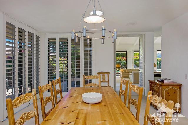 6 Exeter Court Rancho Mirage, CA 92270 - Photo 9 of 20 a living room with furniture and a large window