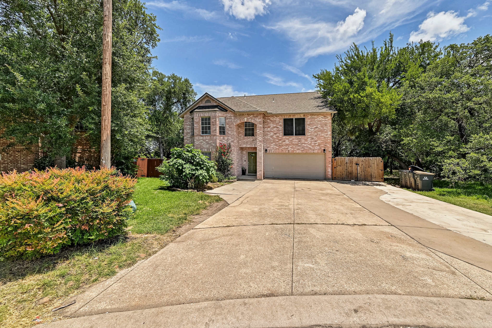 104 North Sumac Lane Georgetown, TX 78633 - Photo 3 of 40 A charming brick exterior with an attached garage welcomes you home.