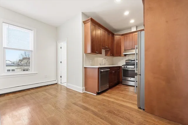 a view of kitchen with wooden floor