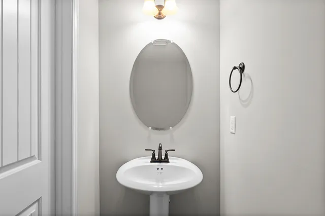 a bathroom with a sink and mirror
