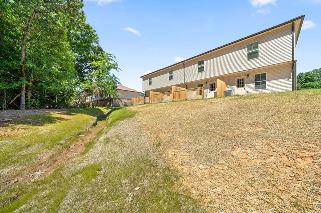 a front view of house with yard and trees