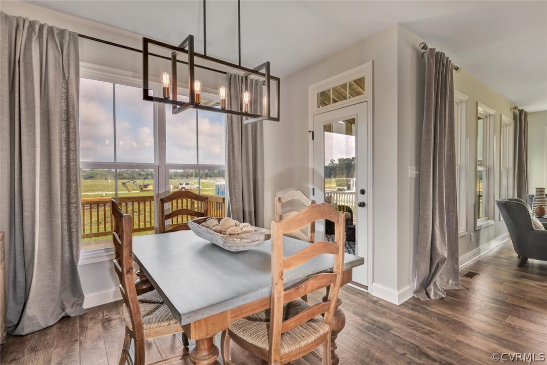 11831 Winterpock Road Chesterfield, VA 23838 - Photo 18 of 34 a view of a dining room with furniture window and wooden floor