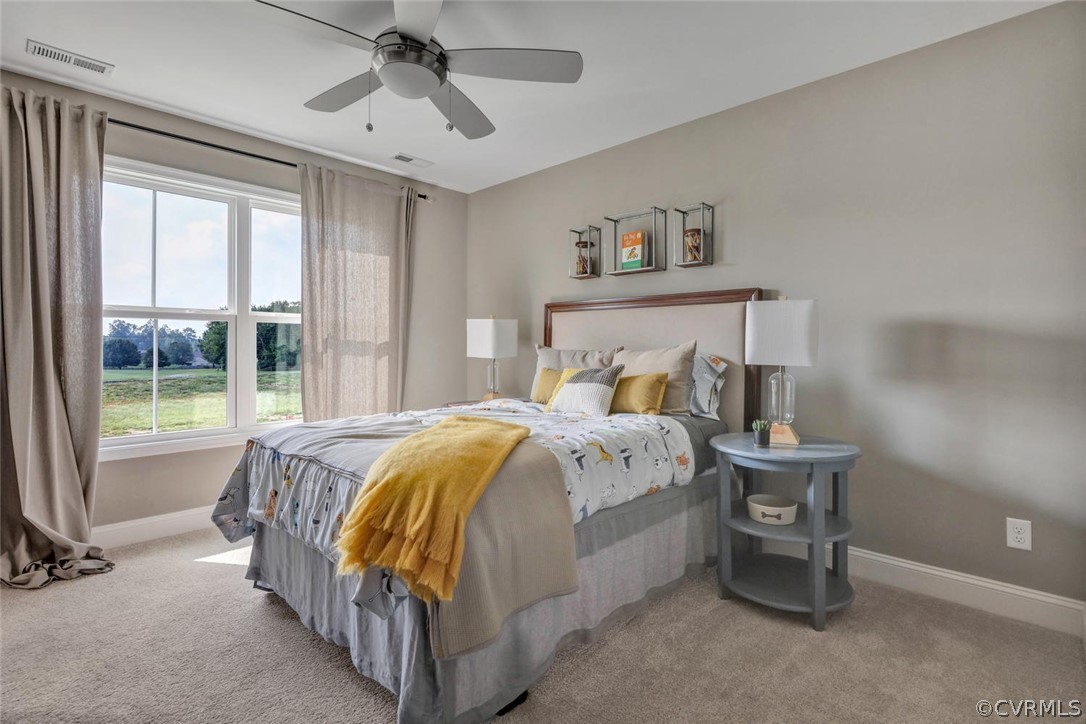 11831 Winterpock Road Chesterfield, VA 23838 - Photo 27 of 34 a bed sitting in a bedroom next to a window