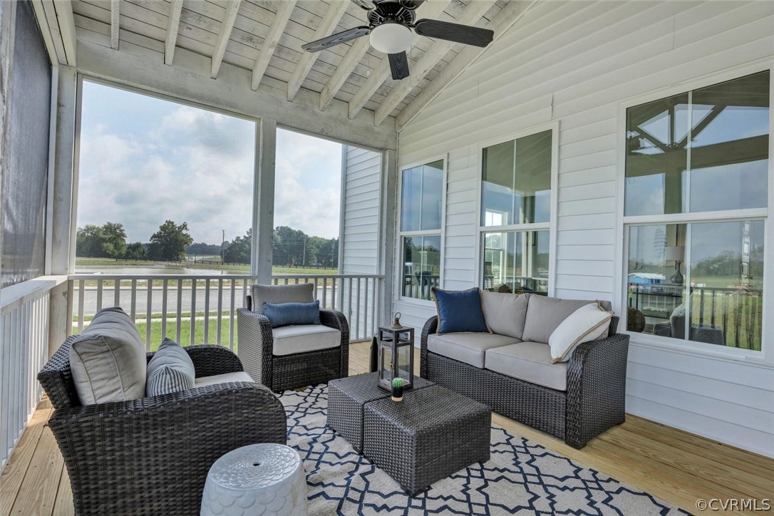11831 Winterpock Road Chesterfield, VA 23838 - Photo 33 of 34 a living room with furniture and a floor to ceiling window