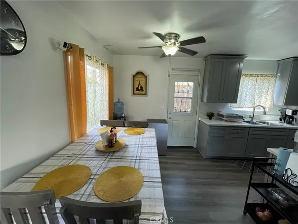 a view of a dining room with furniture and chandelier