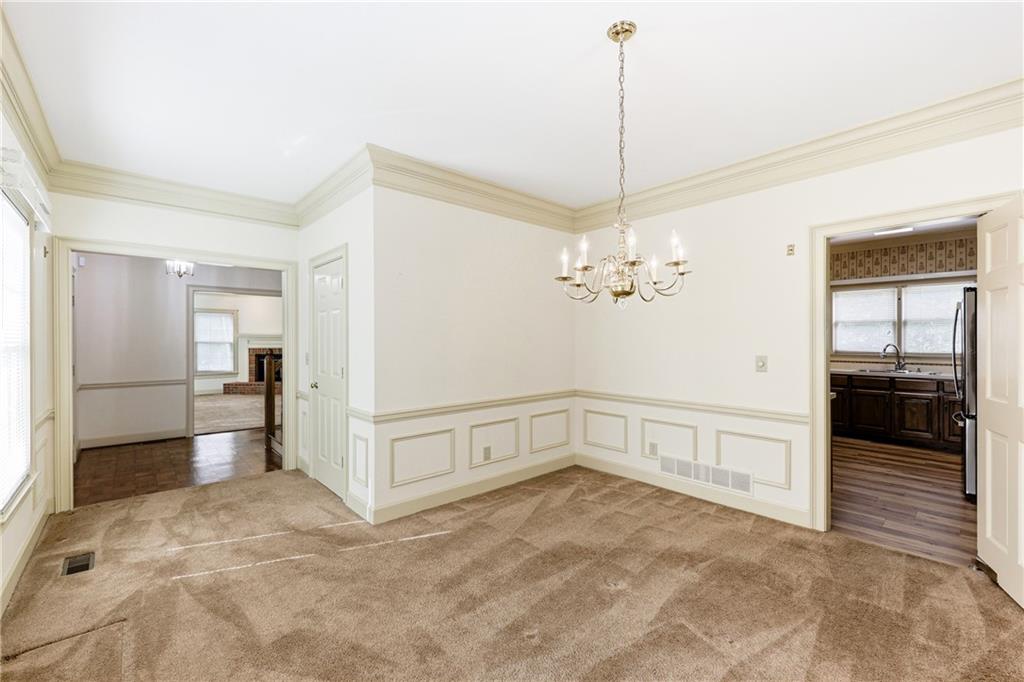 3608 Maple Forge Lane Gainesville, GA 30504 - Photo 10 of 45 a view of a hallway with a chandelier