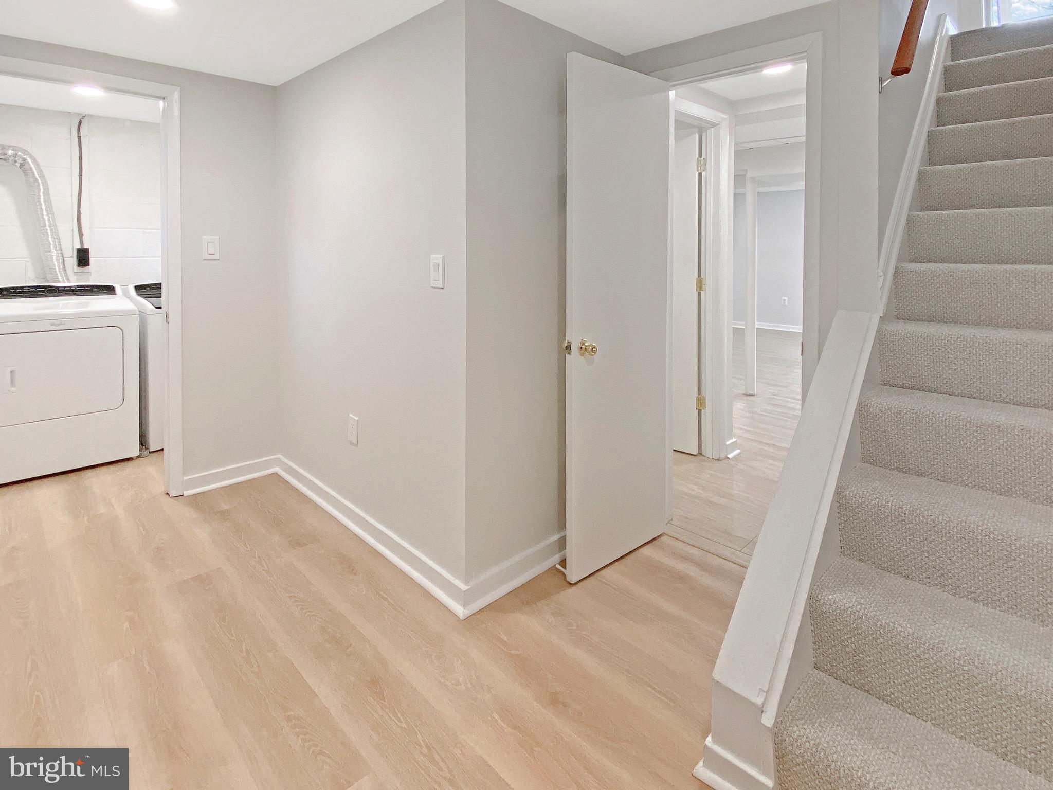 8352 Imperial Drive, Unit 1G Laurel, MD 20708 - Photo 27 of 35 Basement landing area new LVP floor