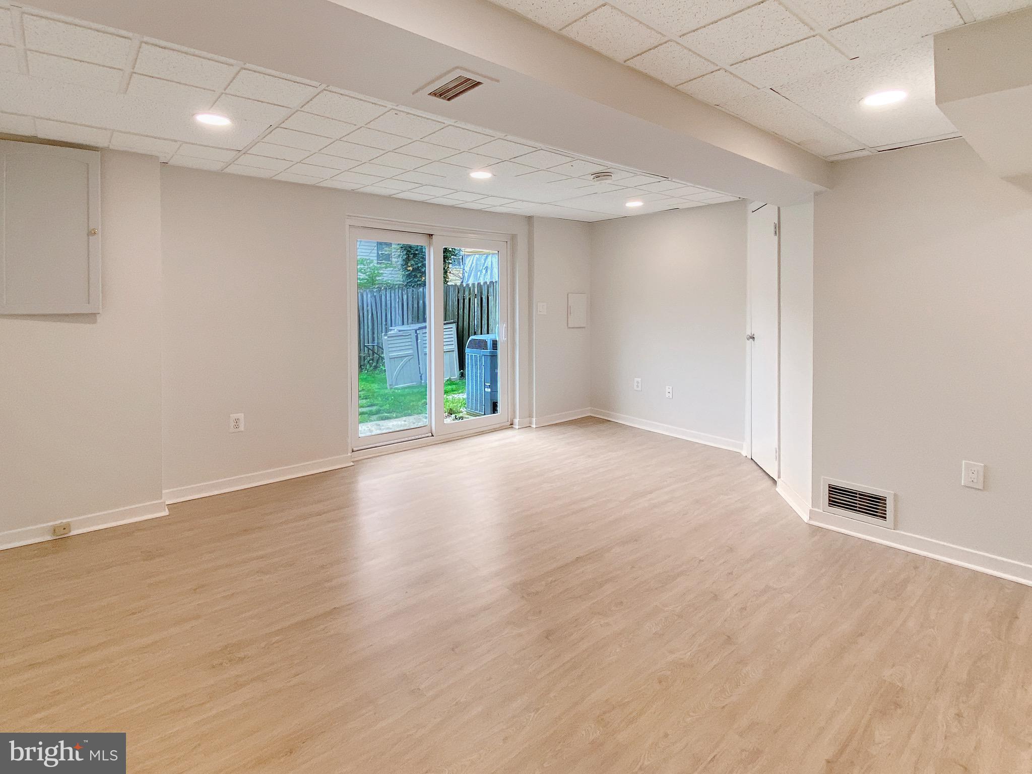 8352 Imperial Drive, Unit 1G Laurel, MD 20708 - Photo 29 of 35 Basement Recreation/Family room w/LVP floor