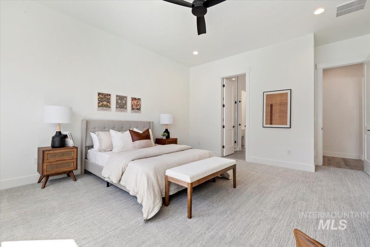 2391 East Snocreek Drive Eagle, ID 83616 - Photo 14 of 29 Bedroom with recessed lighting, light carpet, and ceiling fan