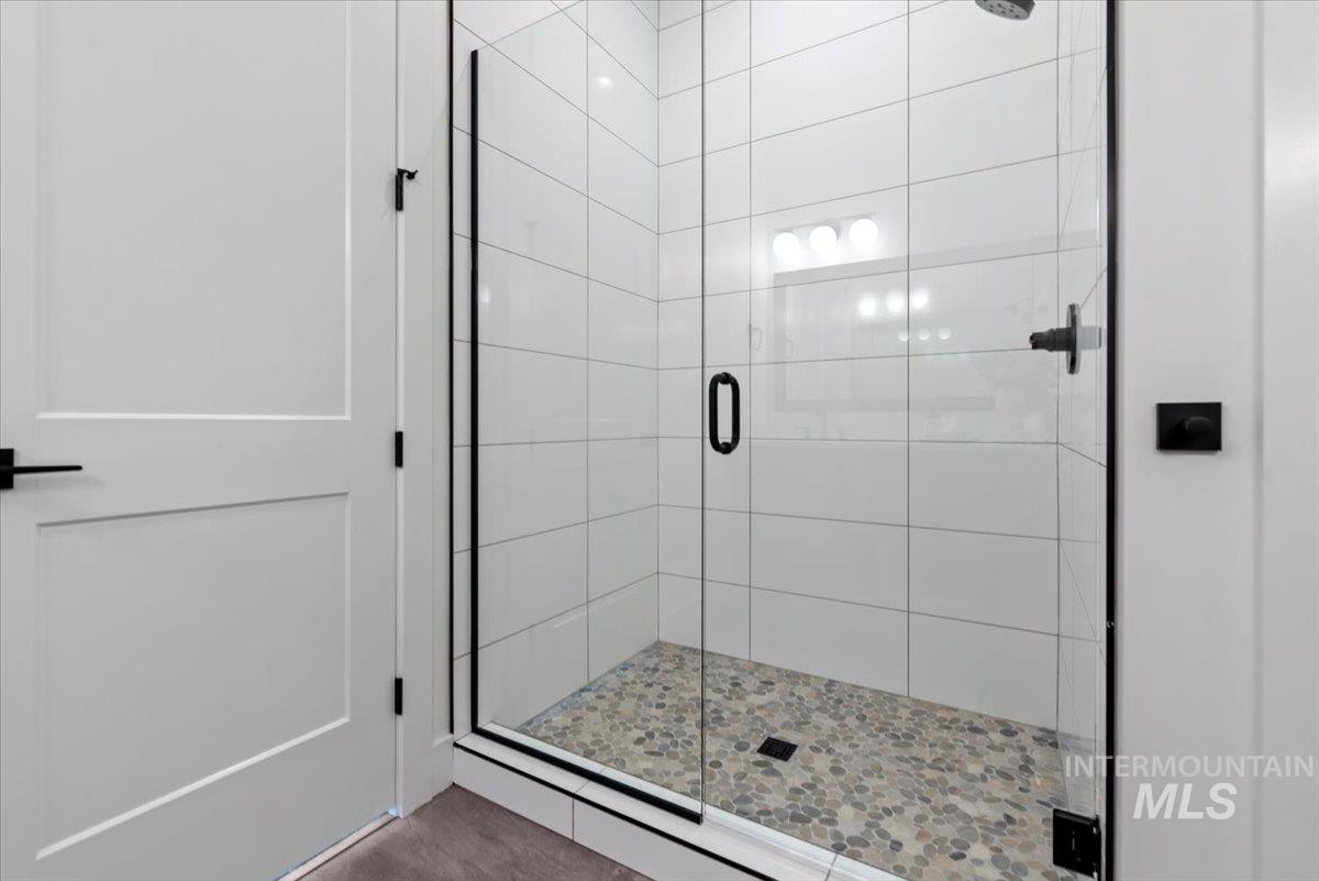 2391 East Snocreek Drive Eagle, ID 83616 - Photo 19 of 29 Bathroom featuring a stall shower
